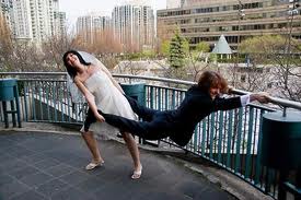 Humorous photo of bride to be trying to drag her groom into the wedding